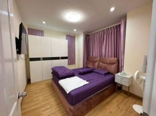 Modern bedroom with purple decor