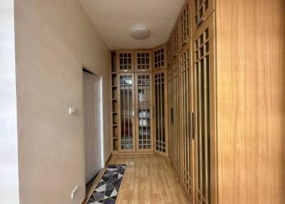 Wooden hallway with built-in cabinets