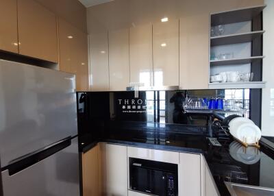 Modern kitchen with stainless steel appliances and ample storage