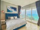 Spacious bedroom with a large bed, modern decor, and a panoramic ocean view