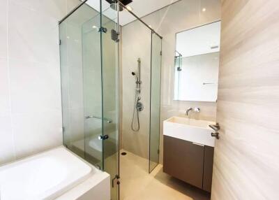 Modern bathroom with glass shower enclosure and sink