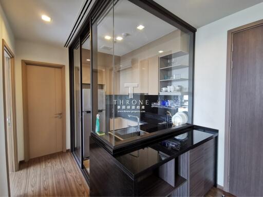 Modern kitchen with glass partitions and built-in appliances