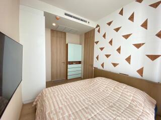 Modern bedroom with geometric accent wall