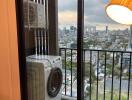 Balcony with view of cityscape featuring a washing machine