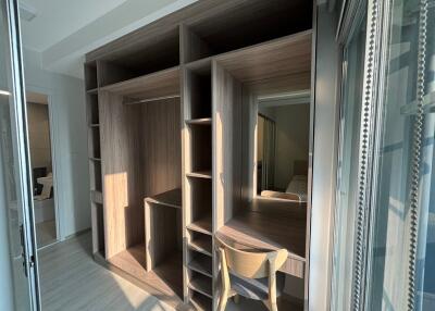 Bedroom with built-in wooden wardrobe and study desk