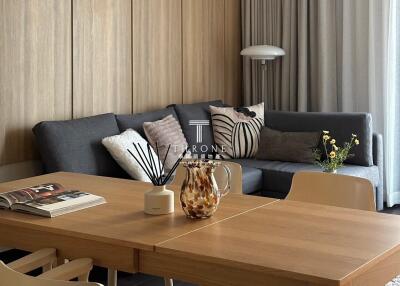 Modern living room with a cozy sofa and dining table