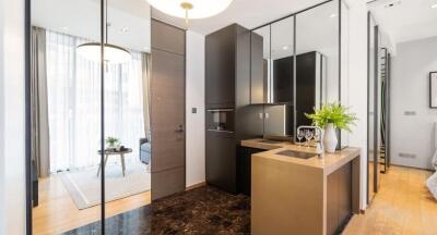 Modern apartment interior with kitchenette, living area, and stylish decor