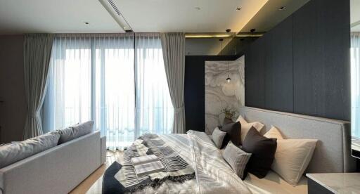 Modern bedroom with large windows and stylish decor