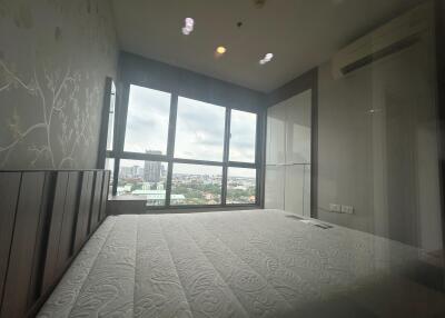 Spacious bedroom with a large window view