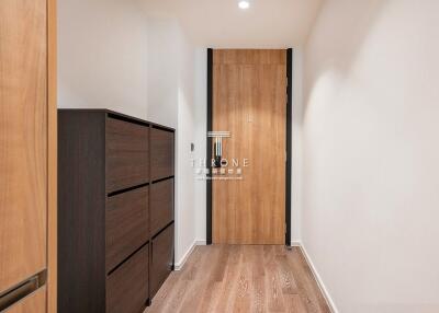 Bright hallway with wooden floors and storage cabinets
