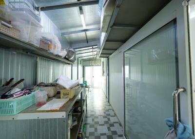 Kitchen with storage shelves and glass door