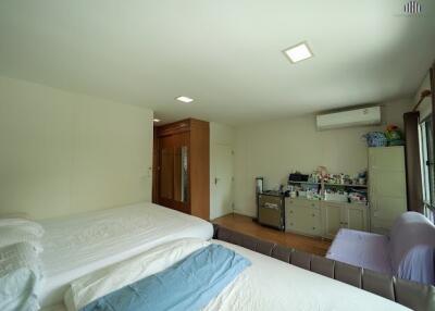 Spacious bedroom with double beds and ample storage