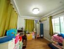 A children's bedroom with toys, storage bins, and a table