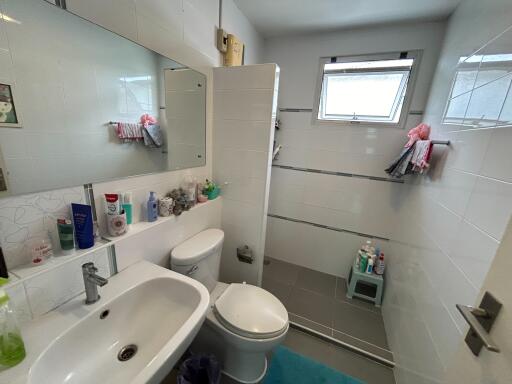 Modern bathroom with large mirror and walk-in shower