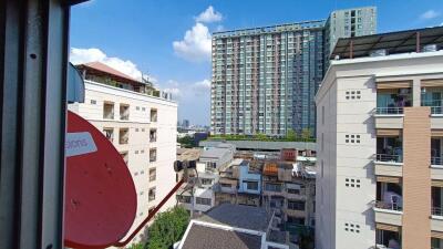 Scenic view of urban buildings from a window