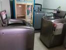 Laundry room with washing machines and a dryer