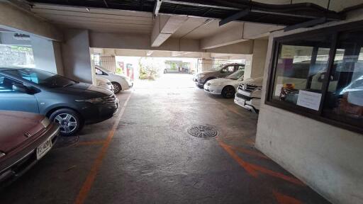 Covered parking area with multiple cars