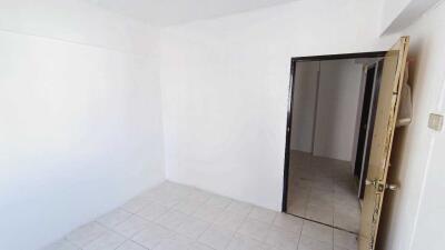 Empty room with white walls and tiled floor