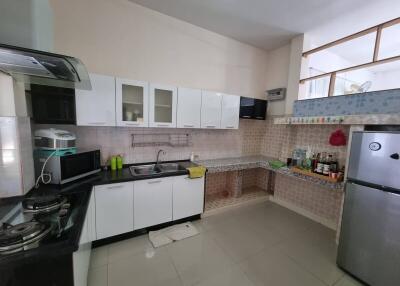 Modern kitchen with cabinets, countertop, and appliances