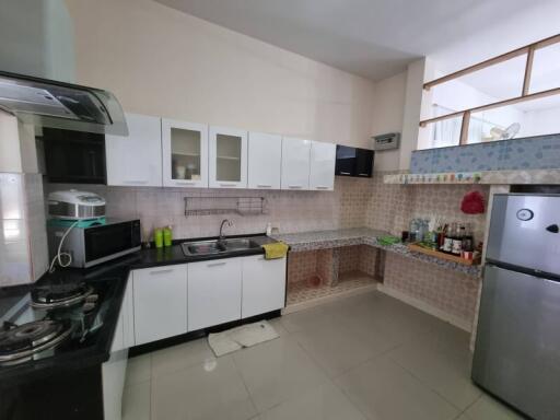 Modern kitchen with cabinets, countertop, and appliances