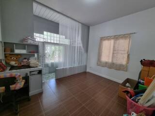 Bedroom with desk and boxes