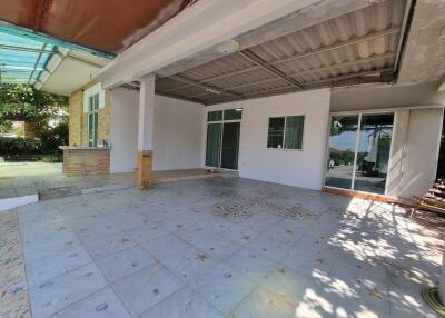Spacious covered outdoor area with tiled floor