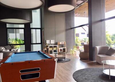 Modern recreational area with pool table and seating