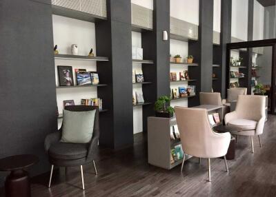 Modern lobby area with bookshelves and seating