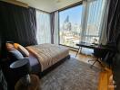 Modern bedroom with large windows and city view