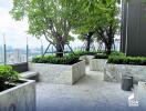 Spacious balcony with greenery and skyline view