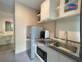 A modern kitchen with appliances and a sink