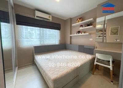 Modern bedroom with built-in furniture and large window