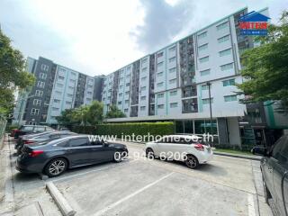 Exterior view of residential building with parking lot