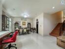 Spacious dining area with a view of the staircase and part of the living room