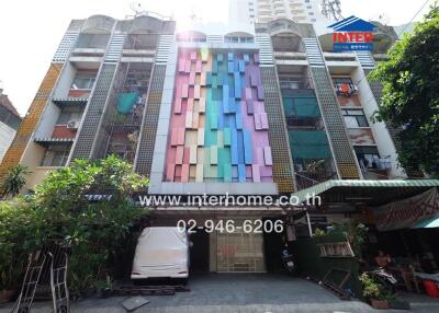 Exterior view of a colorful apartment building