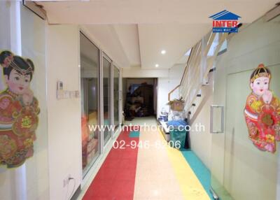 Corridor with colorful floor and sliding glass doors