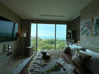 Spacious bedroom with panoramic window view