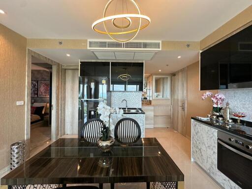 Modern dining area with adjacent kitchen