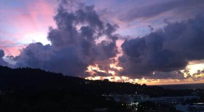 Scenic view of a mountainous area during sunset with clouds in the sky