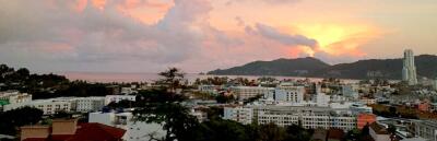 Scenic view of city skyline at sunset