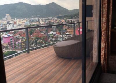 Spacious balcony with city and mountain view