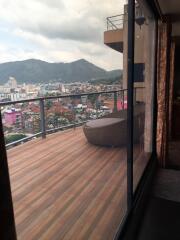 Spacious balcony with city and mountain view