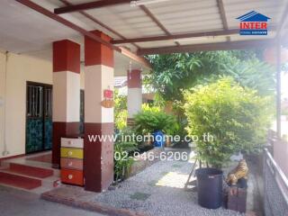 Covered outdoor area with entrance to house