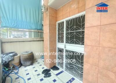 Balcony with tiled floor and storage
