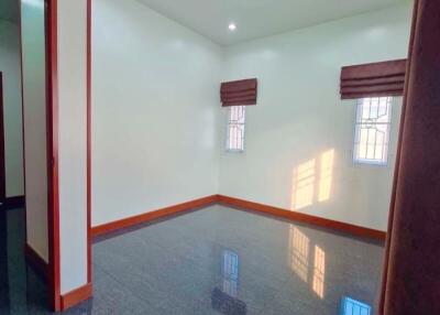 Empty room with windows and glossy floor