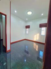 Empty room with windows and glossy floor