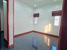 Empty room with windows and glossy floor