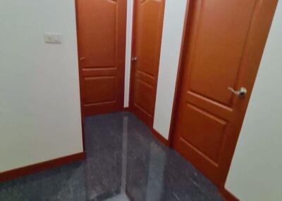 Hallway with three wooden doors