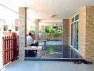 Covered outdoor area with tiled columns