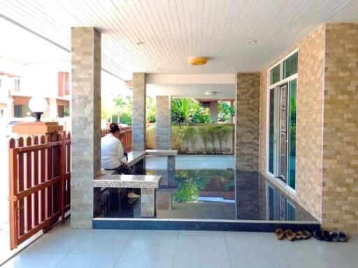 Covered outdoor area with tiled columns